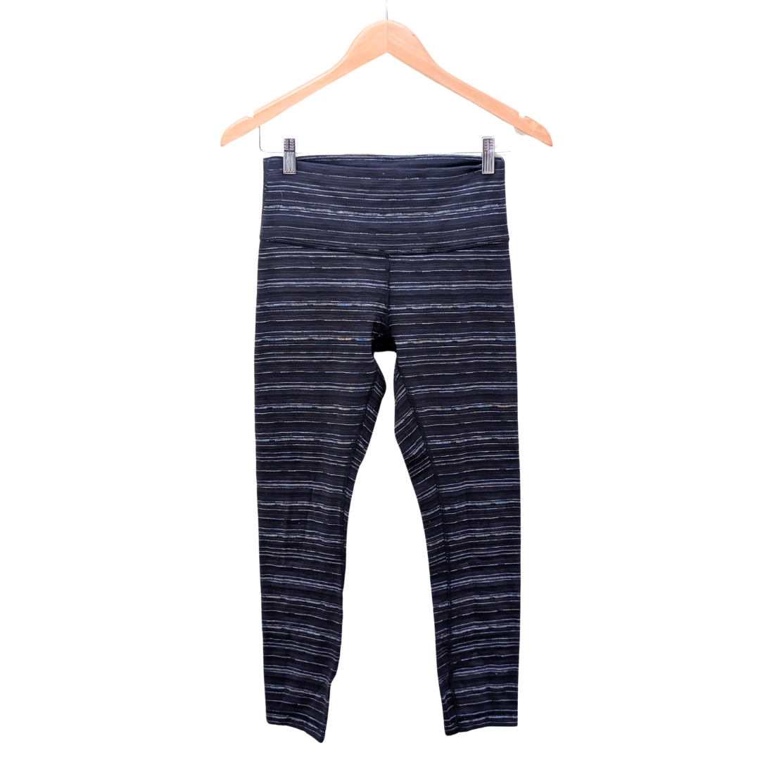 Lululemon blue black striped pants leggings on white background